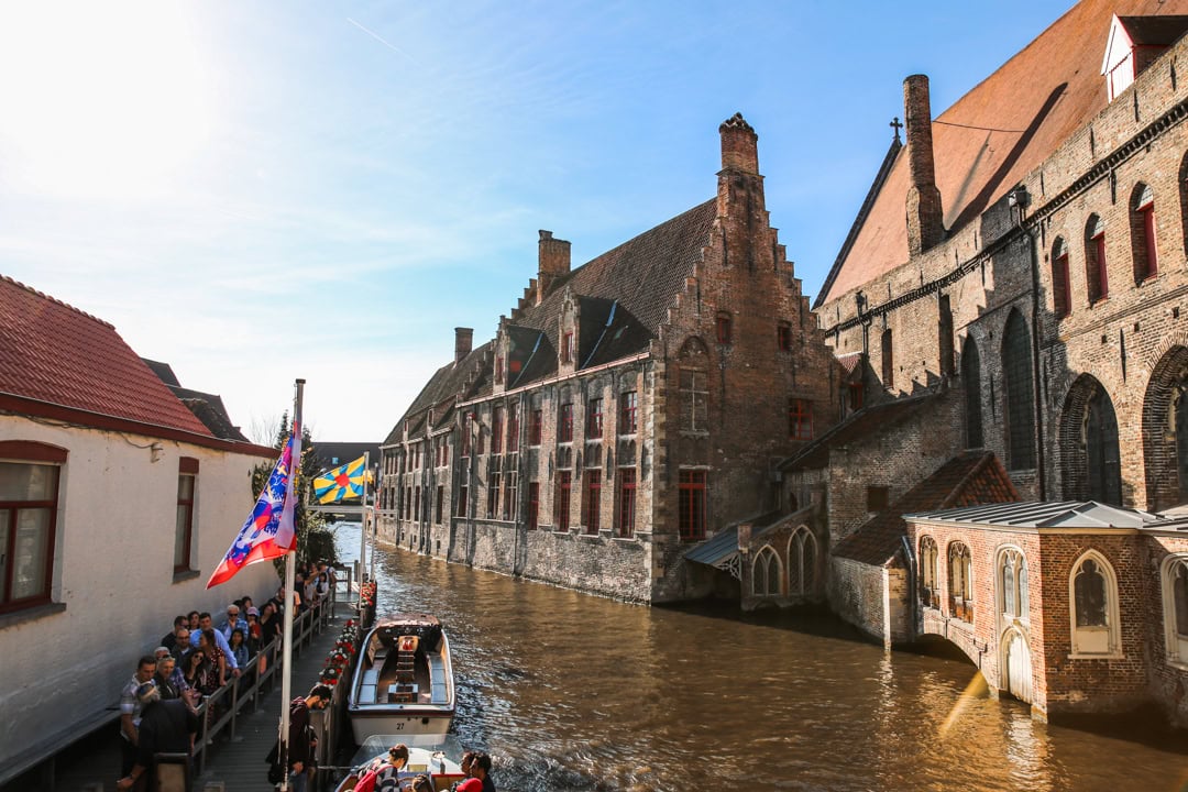 a canal way with old buidlings in the background