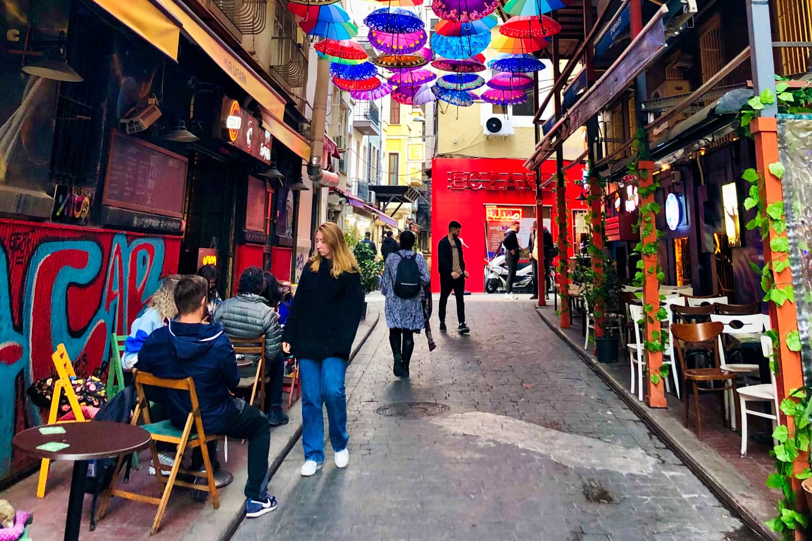 a street in Istanbul with colourful umbrellas hanging above it