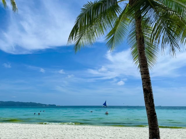 view of white sand beach and ocean in Boracay, ne of the best countries to visit in March