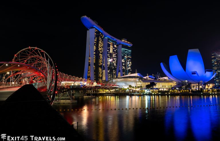 bright lights ligthing up the buildings over the bay in singapore at night