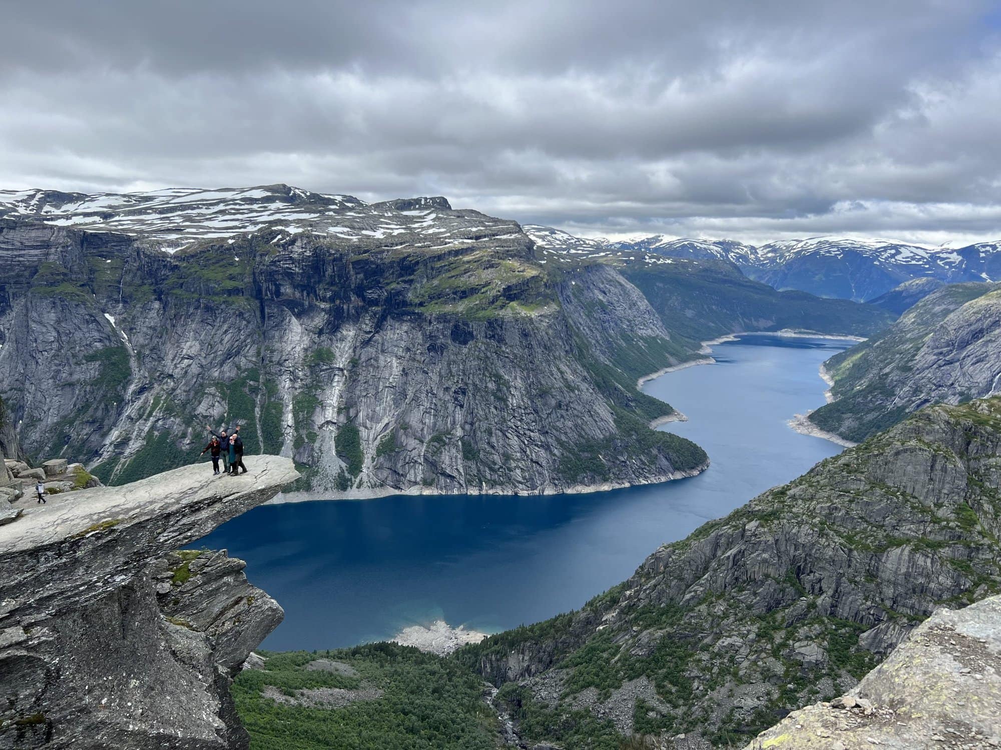 the view from Trolltunga in norway looking down at the fjords