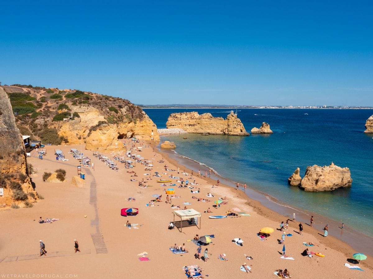 yellow sand beach with lots of people