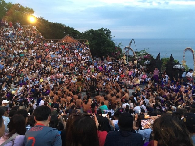 crowd on a hill watching kecak dancers in bali
