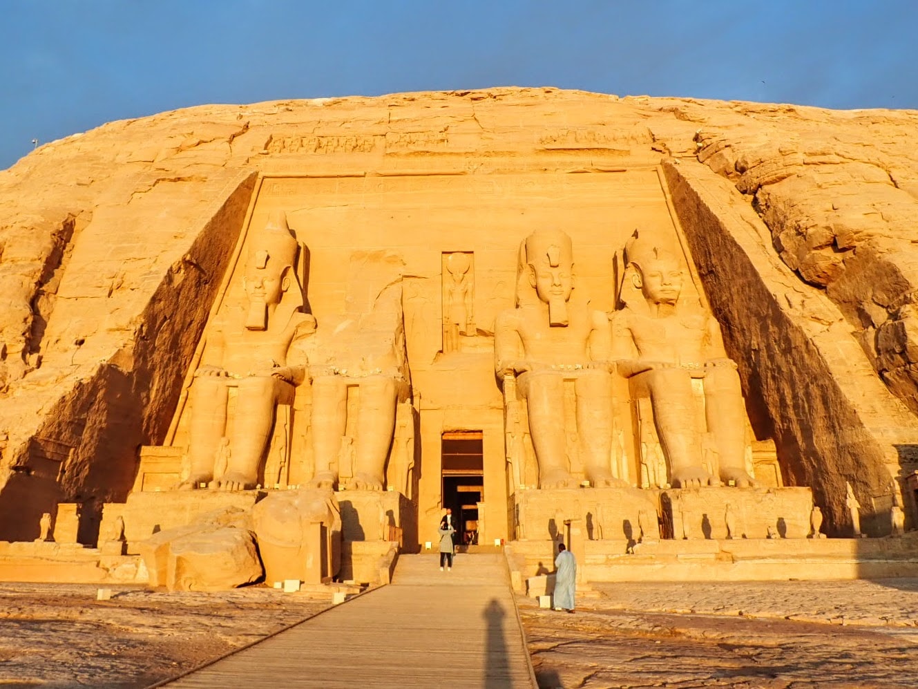 Visitors admire the Great Temple at Abu Simbel shortly after sunrise.
