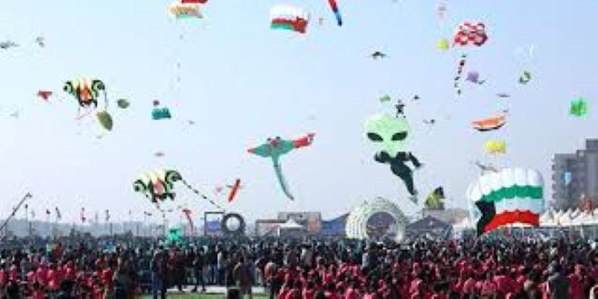 a sky full of kites at International Kite Festival, Gujarat India