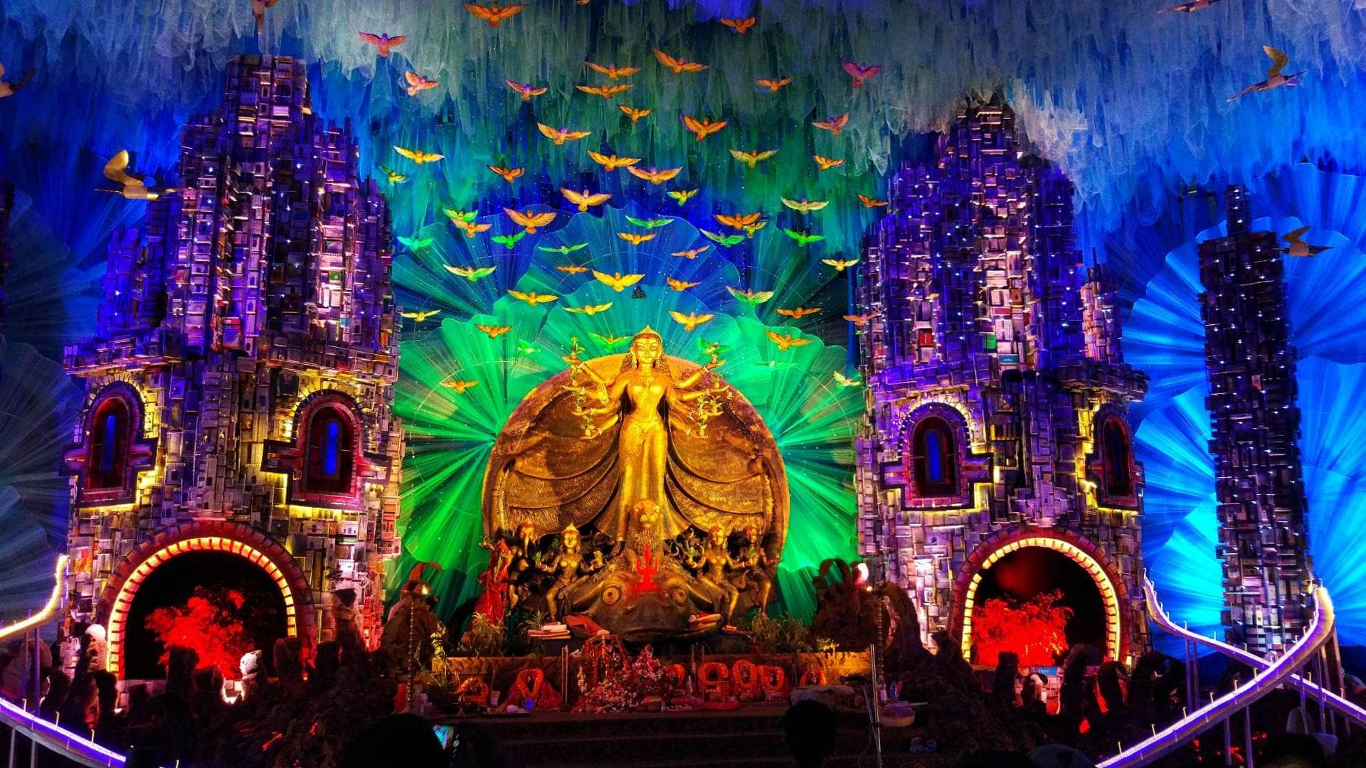 festival decorations and lit up statues in india