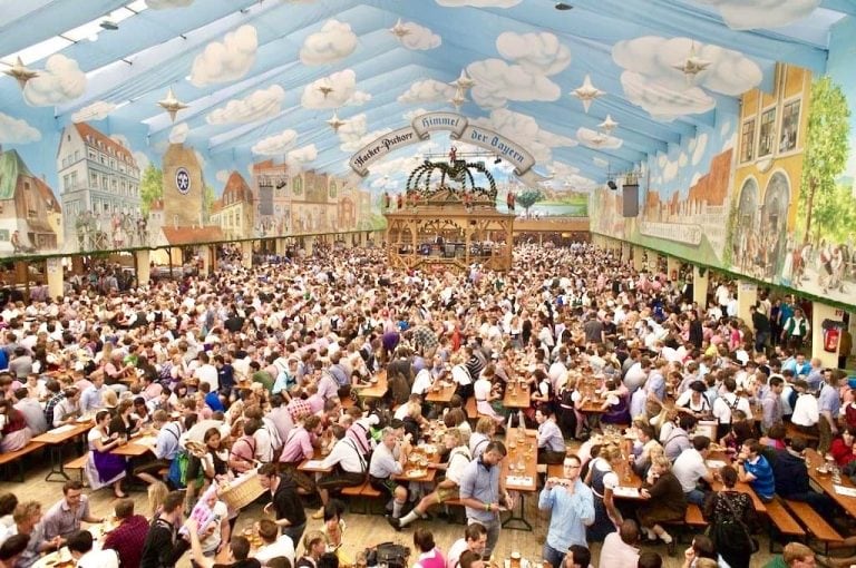 beer hall during oktoberfest in germany with lots of tables of people