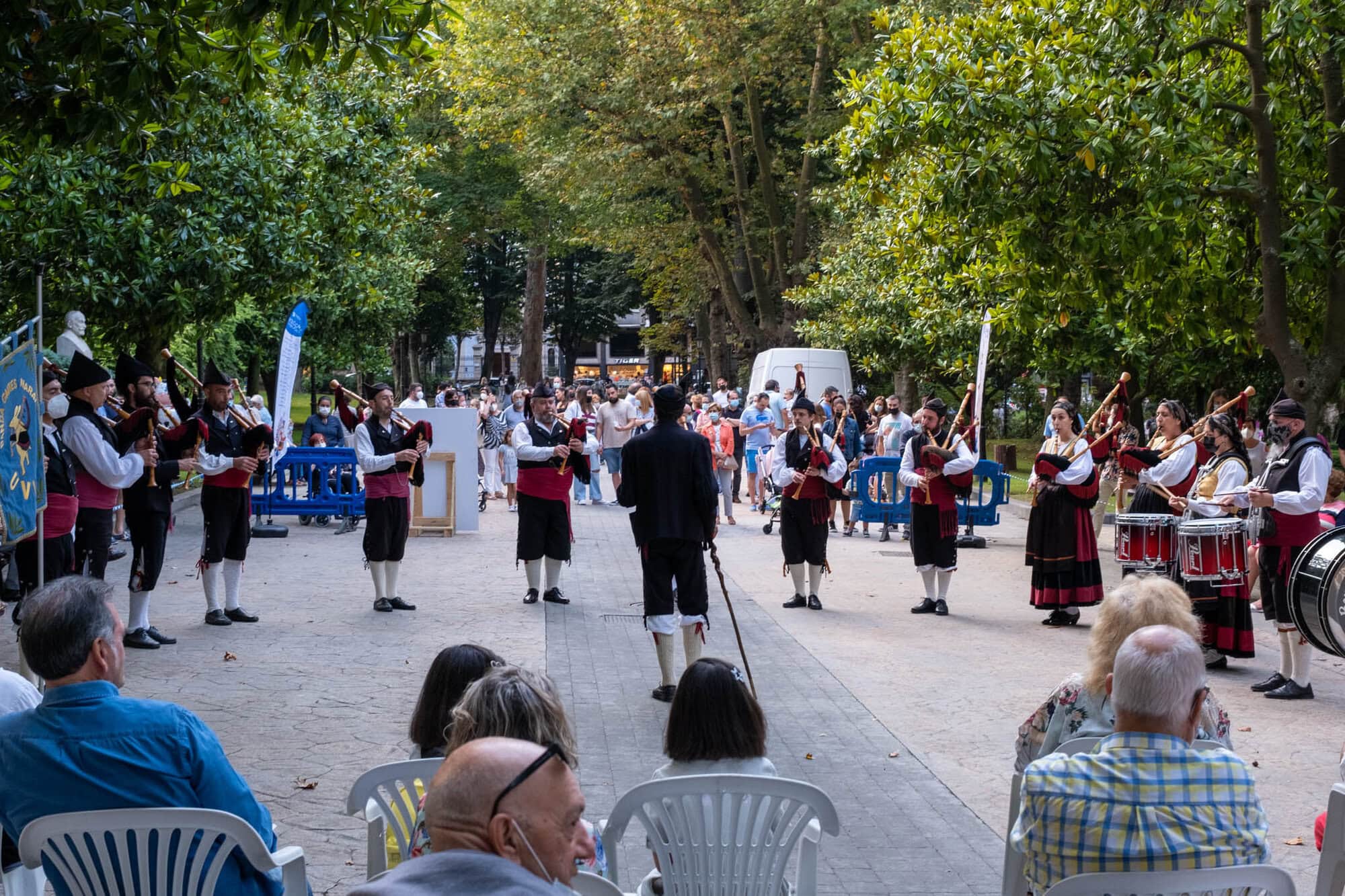 musicians performing on the street in traditional dress in spain