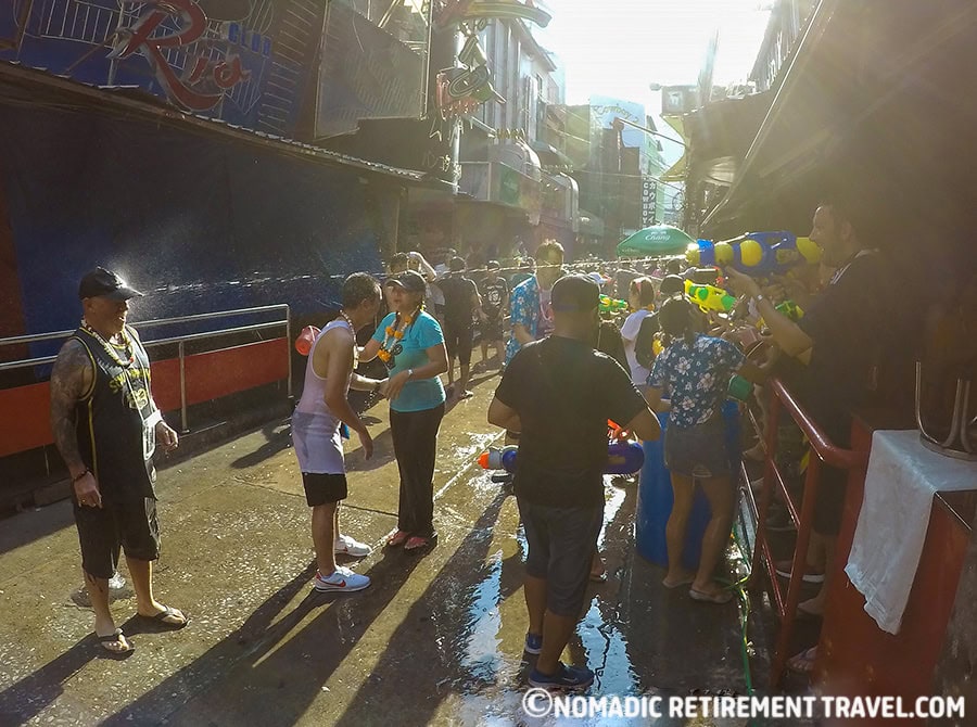 massive water fight in the street with both locals and tourists