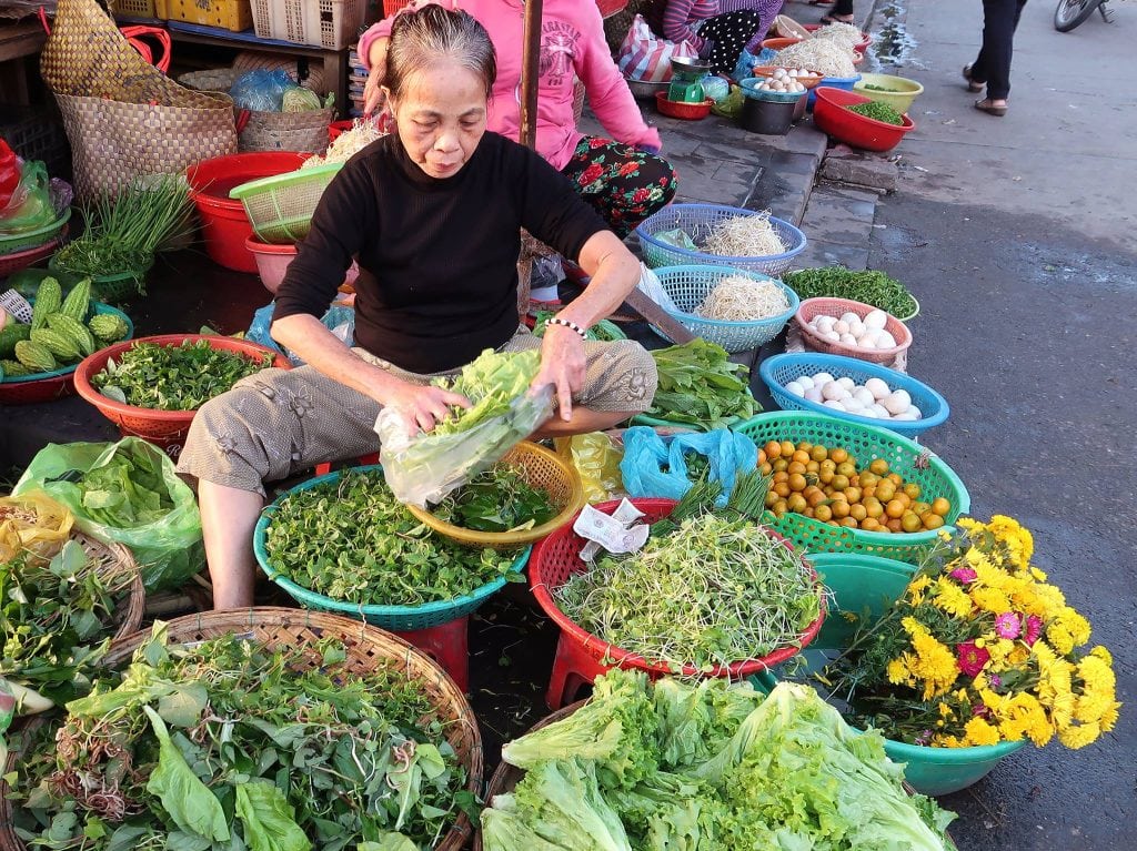 a vietnamese woman at a local market