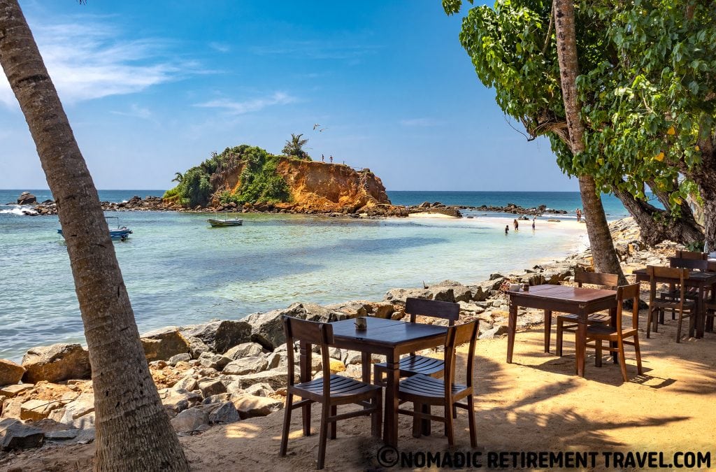 restaurant tables overlooking beach in mirissa