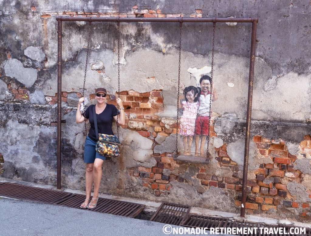 street art - painting of kids on a swing