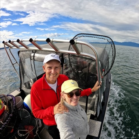 a couple on a boat in the ocean