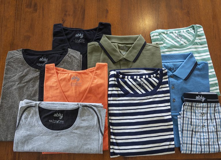 an arrangement of ably t-shirts in different colours and patterns