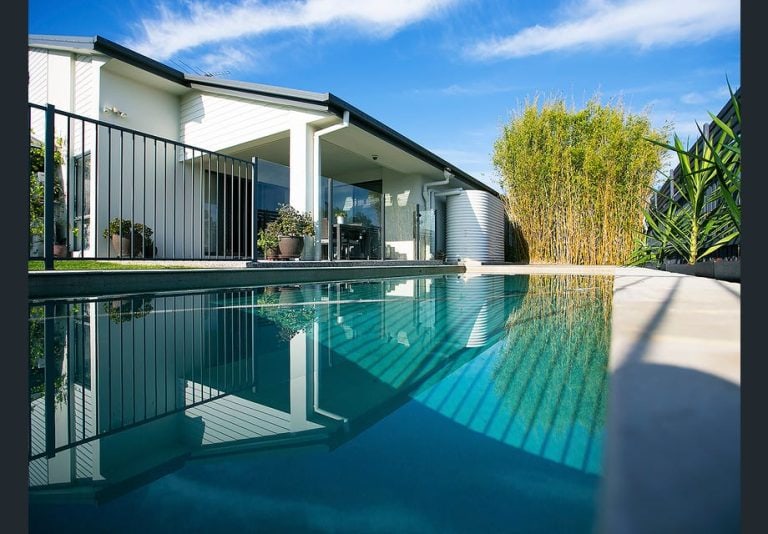 view of home and pool from the pool edge