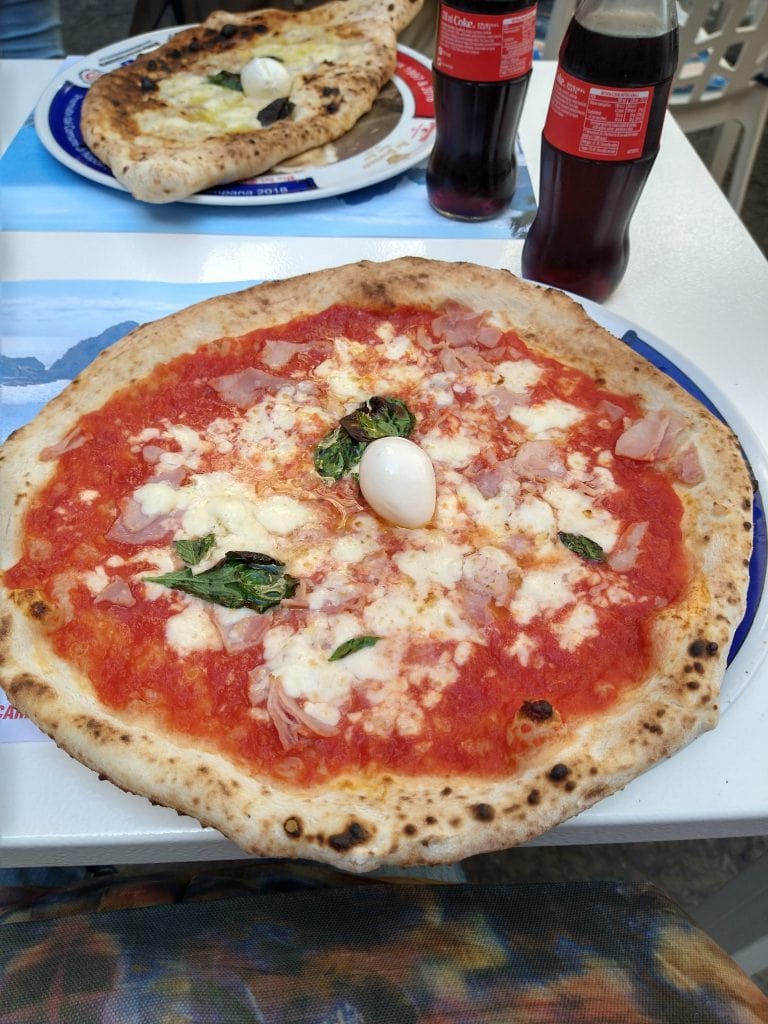 Authentic pizza in Naples Italy while experiencing long-term travel lifestyle