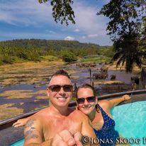 Couple enjoying pool view in Sri Lanka while planning long-term travel lifestyle