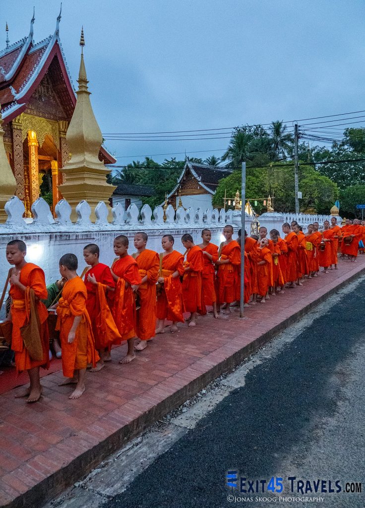 Monks collecting morning alms in Luang Prabang during long-term travel experience