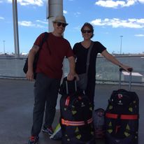 Couple with luggage starting their journey showing how to pack for long term travel