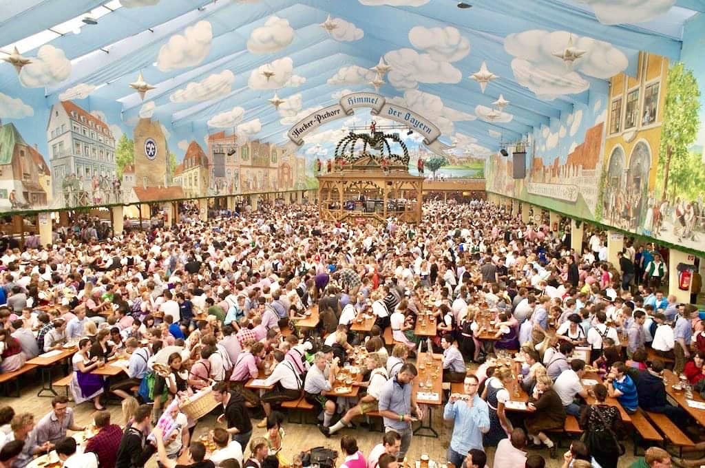 Crowds inside Oktoberfest beer tent in Munich, Germany in September, popular for best countries to visit by month