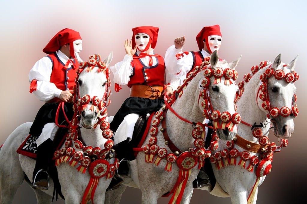 Traditional masked riders at Sartiglia Festival in Sardinia, Italy in February, one of the best countries to visit by month