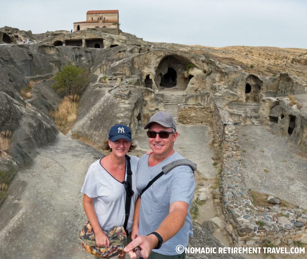 Couple travelling full time exploring cave city in Georgia showing real full-time travel lifestyle