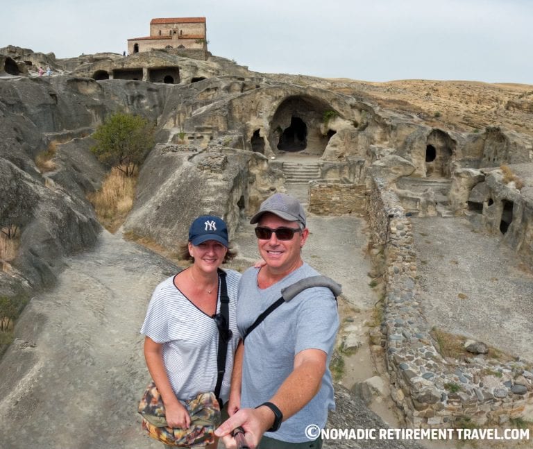 Couple travelling full time exploring cave city in Georgia showing real full-time travel lifestyle