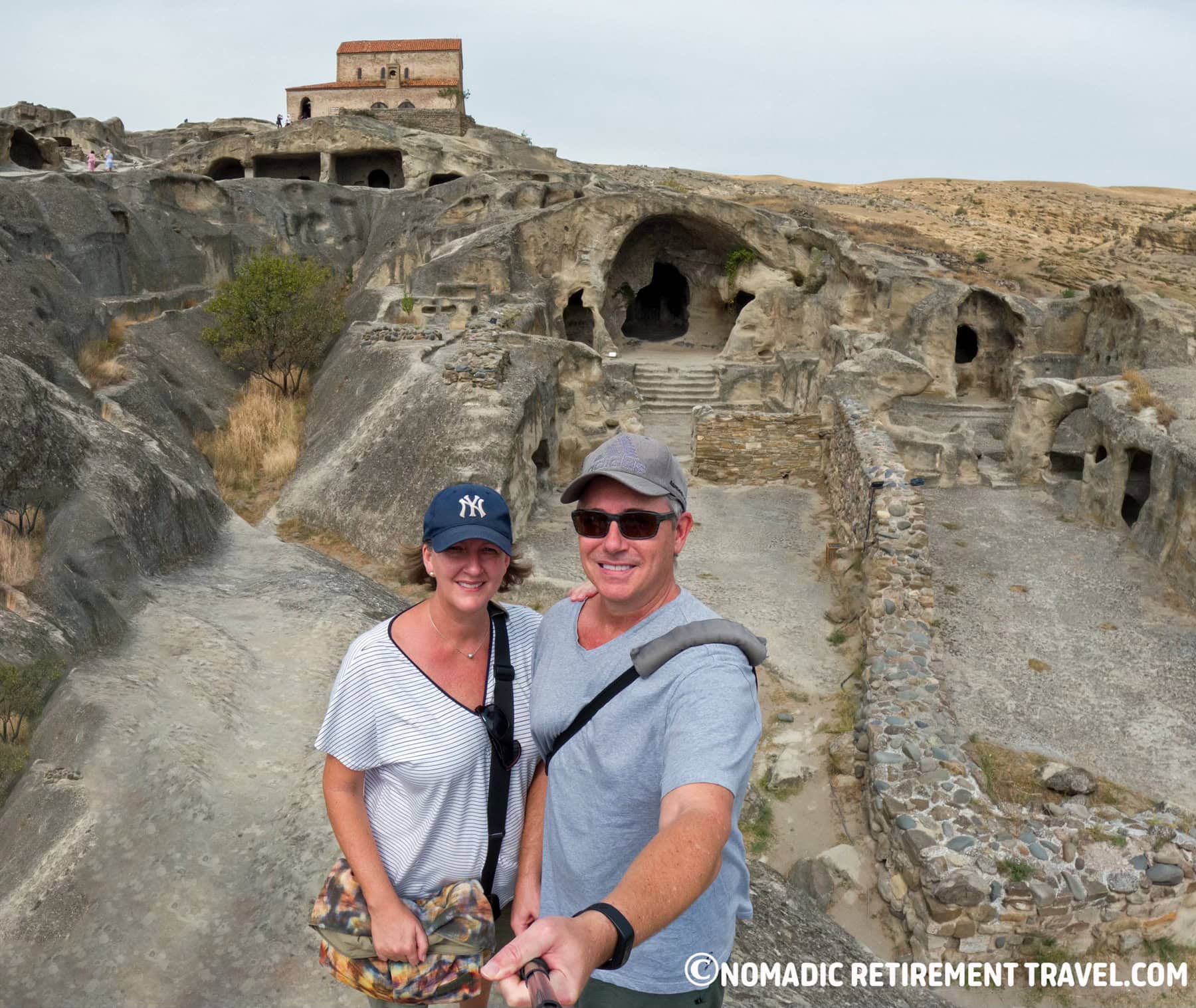 Couple travelling full time exploring cave city in Georgia showing real full-time travel lifestyle