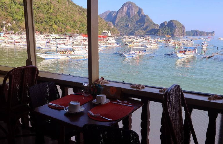 Breakfast with ocean view in El Nido showing real full-time travel lifestyle, not just a holiday