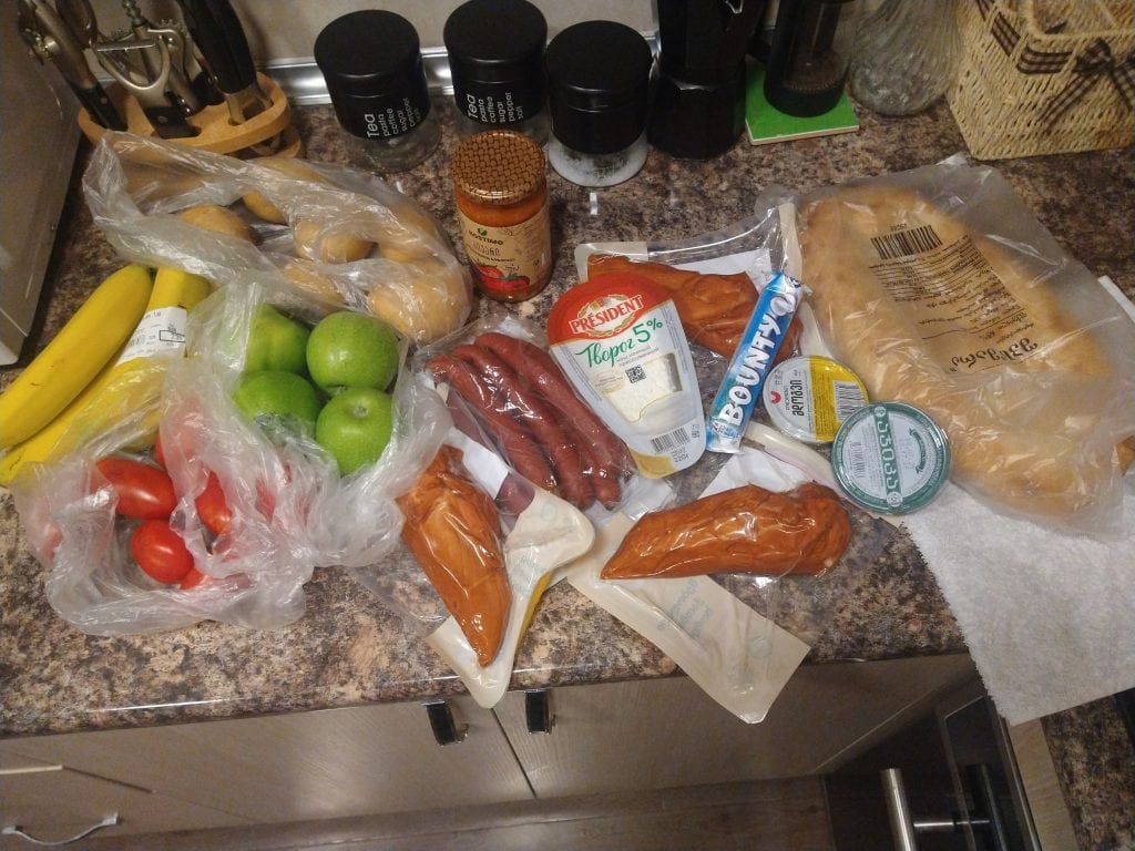 Groceries laid out on a kitchen counter showing everyday shopping while travelling