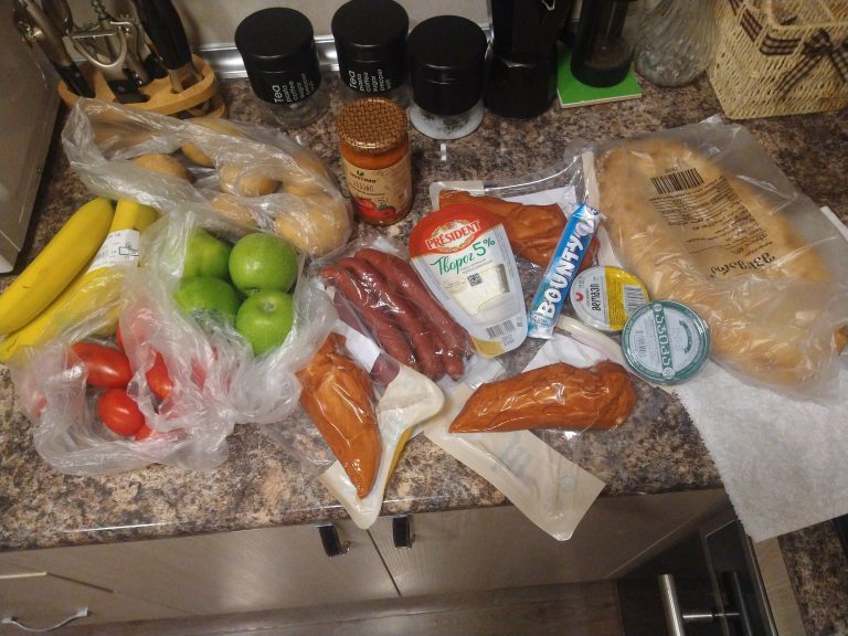 Groceries laid out on a kitchen counter showing everyday shopping while travelling