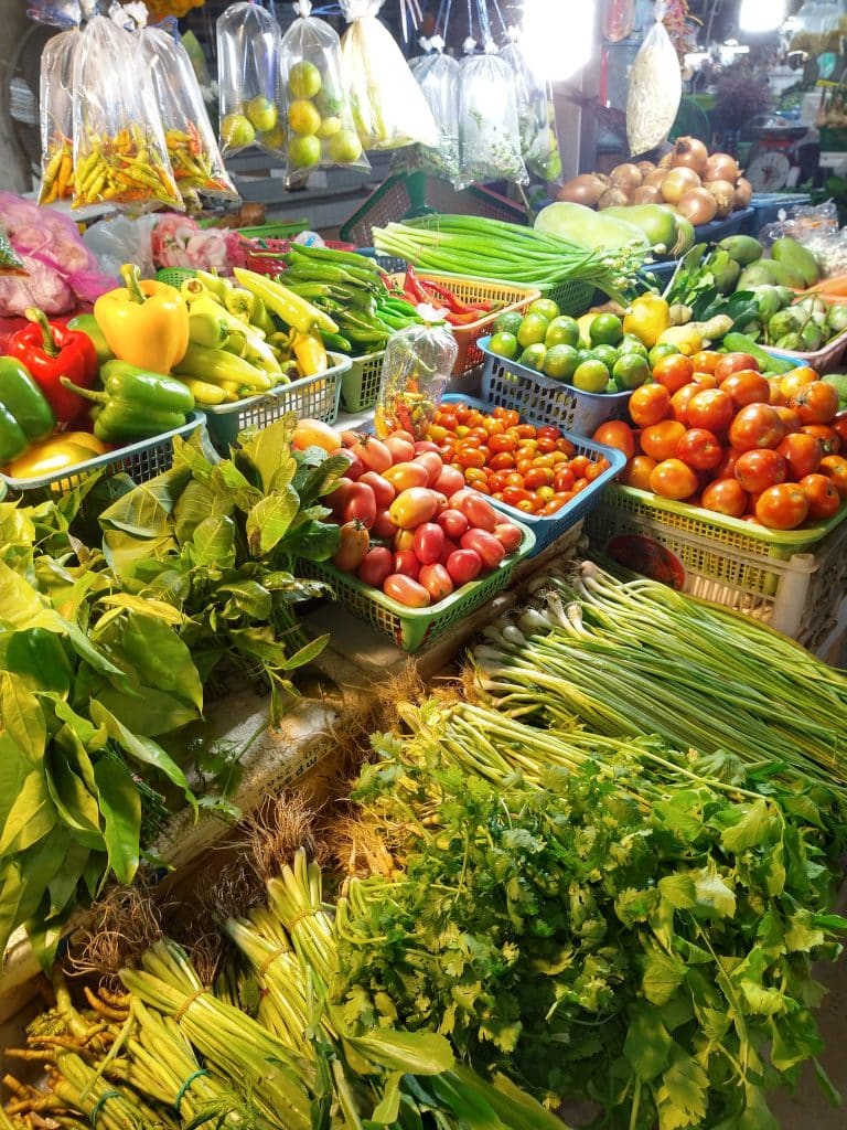 Fresh local market produce highlighting affordable food costs while travelling full-time