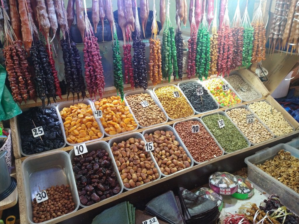 Local market in Kutaisi, Georgia with dried fruits and nuts, a simple slow travel destination