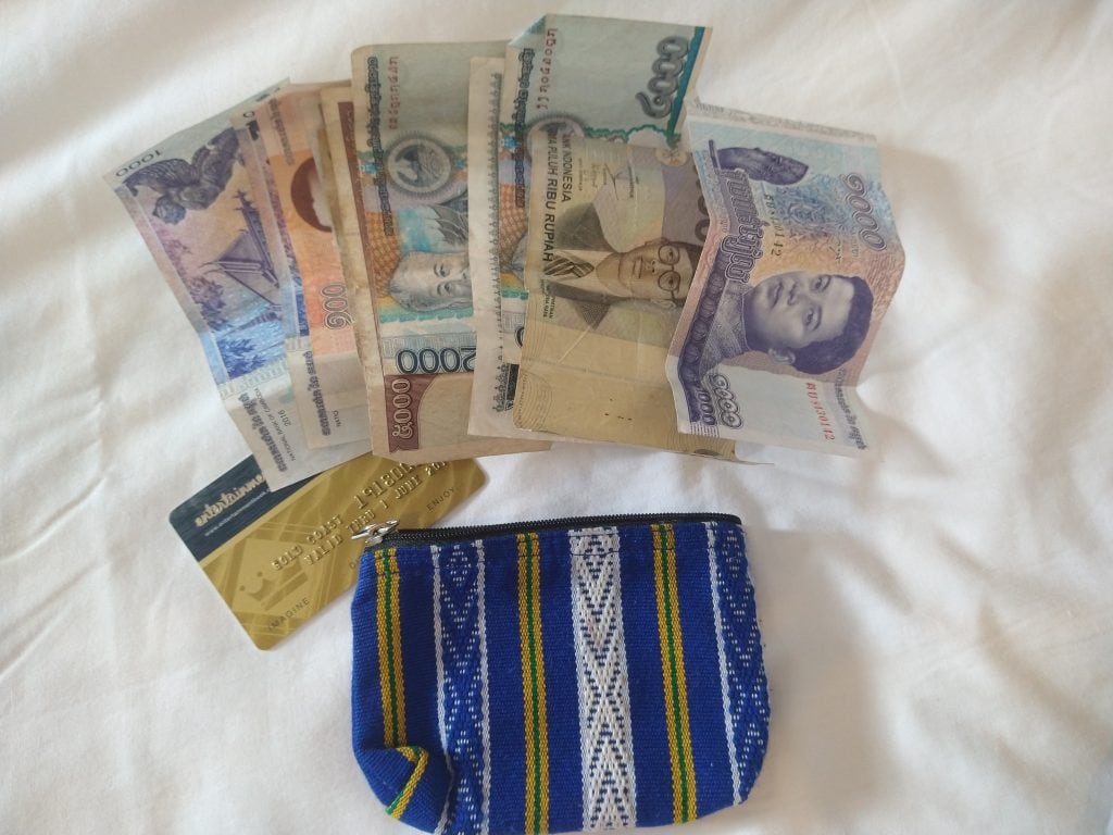 Decoy wallet containing expired cards and low-value foreign currency for travel safety.